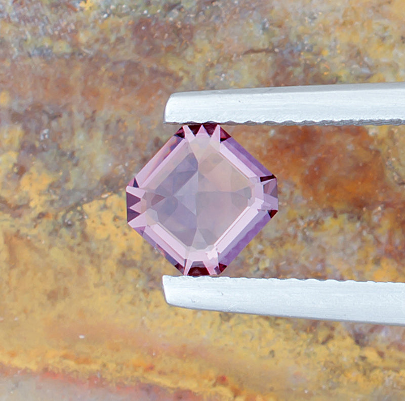 0.89ct Lavender Spinel Colored Gemstone Bottom View Natural Background