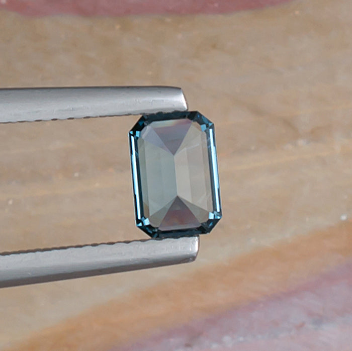 0.92ct Blue Topaz Colored Gemstone Bottom View Natural Background 
