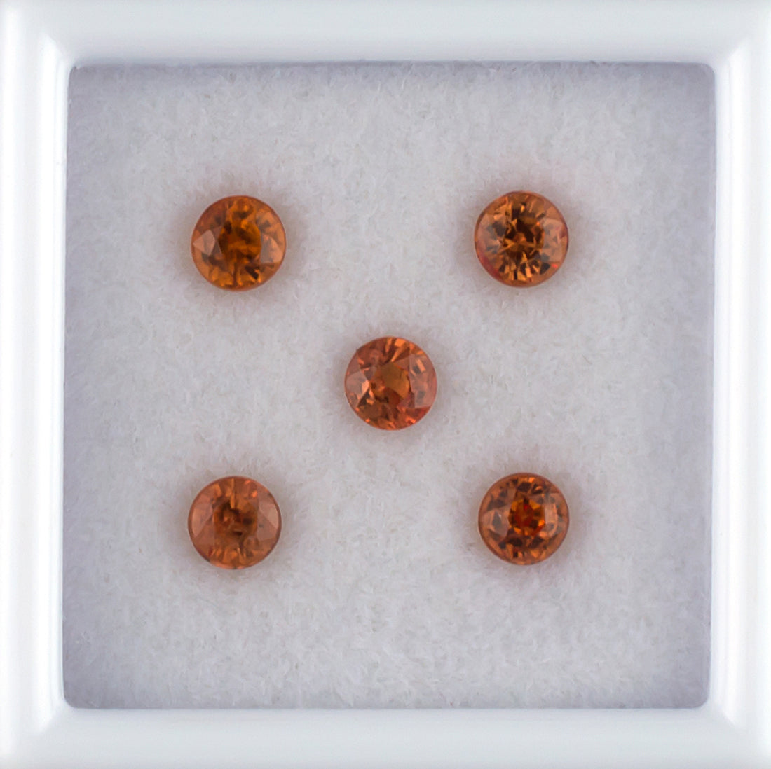 1.18twt Orange Sapphire Colored Gemstone Melee Parcel Top View White Background 
