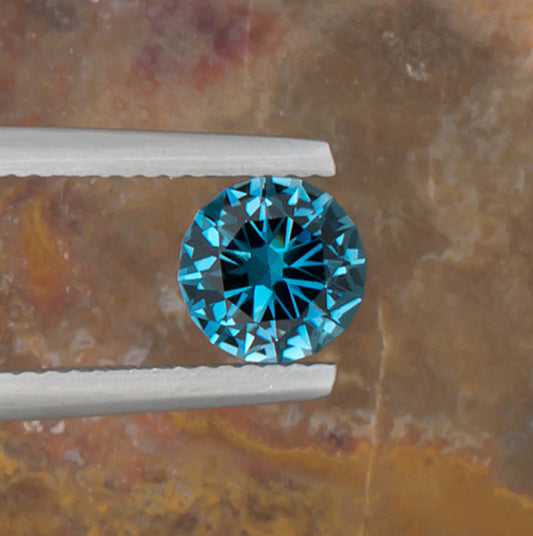 1.24ct Blue Topaz Colored Gemstone Top View Natural Background 
