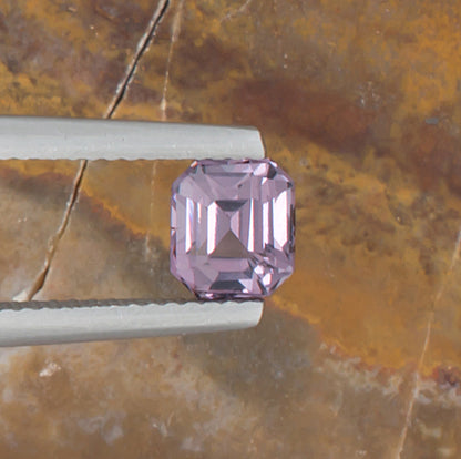 1.24ct Lavender Spinel Colored Gemstone Top View Natural Background 
