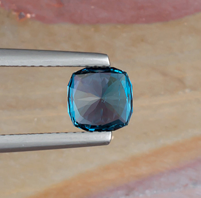 1.65ct Blue Topaz Colored Gemstone Bottom View Natural Background 
