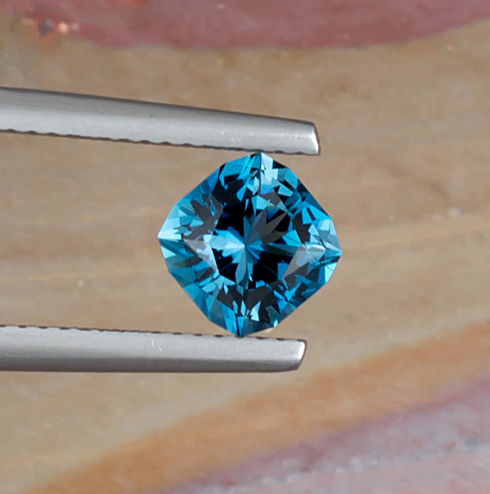 1.65ct Blue Topaz Colored Gemstone Top View Angle Natural Background 
