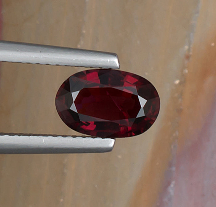 1.70ct Red Spinel Colored Gemstone Top View II Natural Background 
