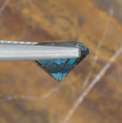 2.15ct Blue Topaz Colored Gemstone Side View Natural Background