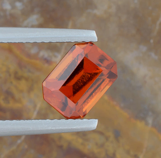 2.18ct Hessonite Garnet Colored Gemstone Top View Natural Background
