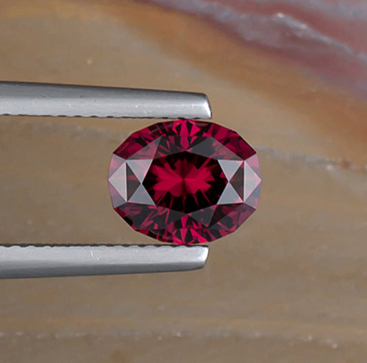 2.26ct Umbalite Garnet Colored Gemstone Top View Natural Background
