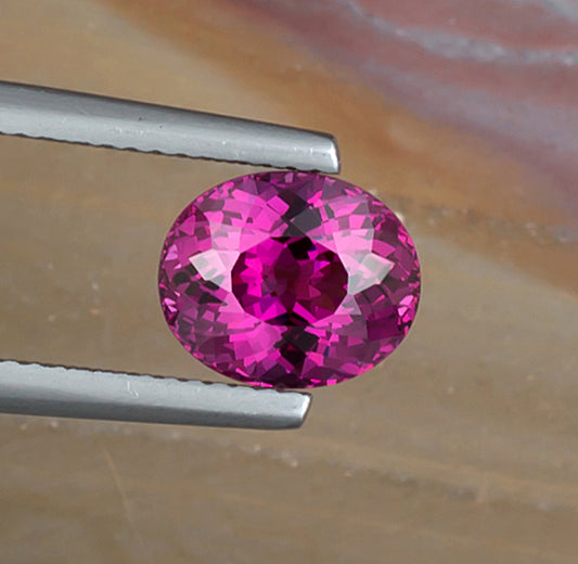 2.96ct Rhodolite Garnet Colored Gemstone Top View II Natural Background 
