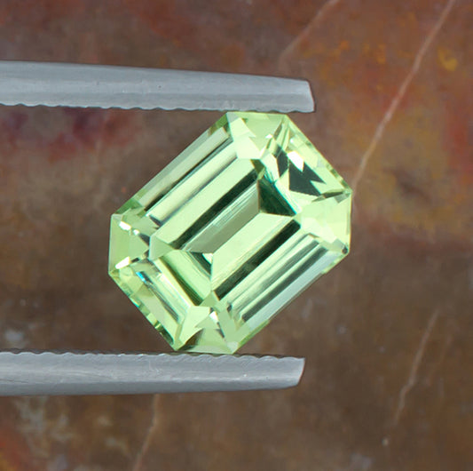 3.12ct Peridot Colored Gemstone Top View Natural Background