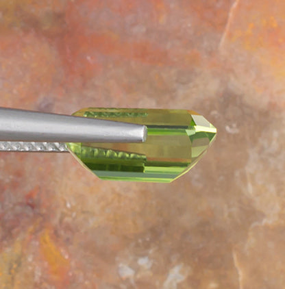 3.17ct Peridot Colored Gemstone Side View Natural Background 
