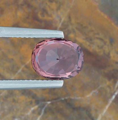 3.25ct Pink Sapphire Colored Gemstone AGL Certificate Bottom View Natural Background 