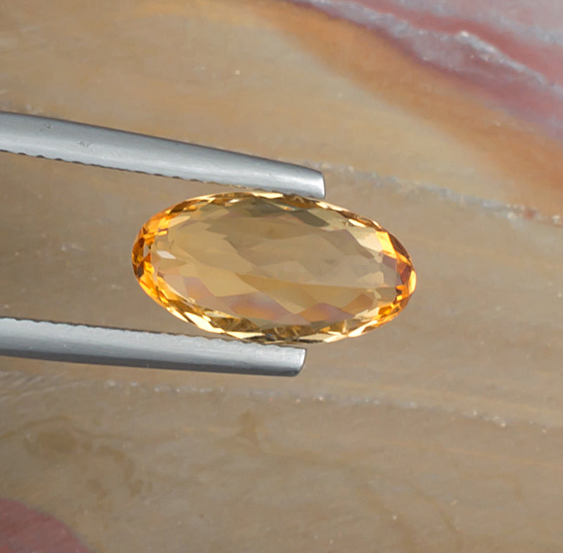 3.35ct Imperial Topaz Colored Gemstone Bottom View Natural Background 
