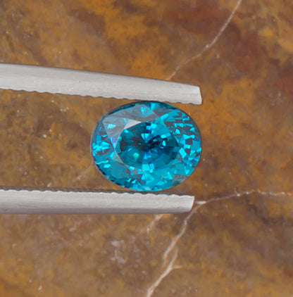 3.63ct Blue Zircon Colored Gemstone Top View Horizontal Natural Background 