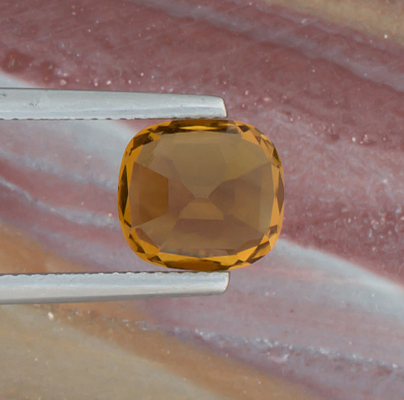 3.86ct Citrine Colored Gemstone Back View Natural Background 
