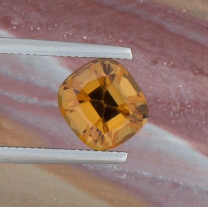 3.86ct Citrine Colored Gemstone Top View Angle Natural Background 
