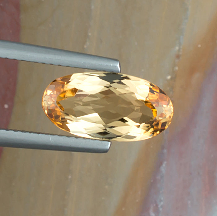 4.13ct Imperial Topaz Colored Gemstone Top View II Natural Background 
