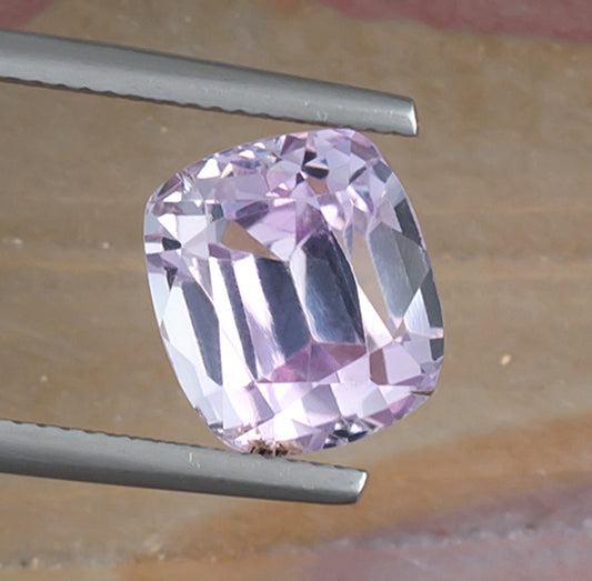 7.95ct Kunzite Colored Gemstone Top View Angle Natural Background 
