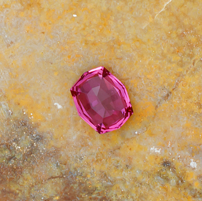 0.92ct Rhodolite Garnet Colored Gemstone Bottom View Natural Background